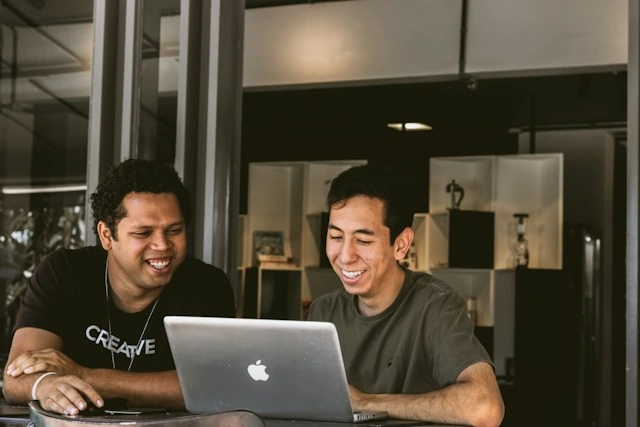 Two colleagues laughing
Employee feedback is given and received